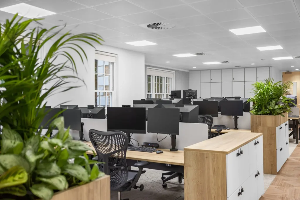 Work areas with desks and computers