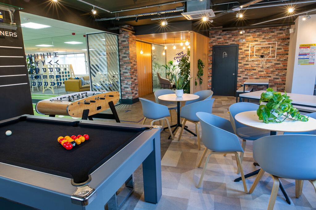 Leisure area with pool table, table football, tables with chairs