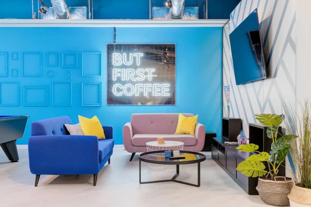 Leisure area with sofas, TV, and LED signage