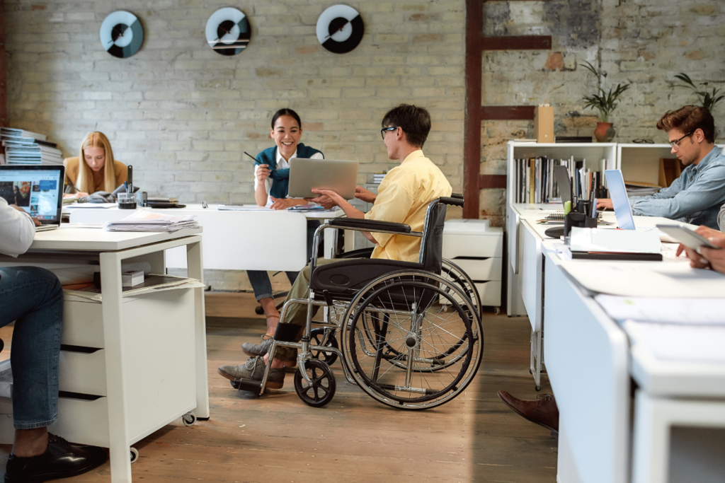 Office with a person in a wheelchair around desks